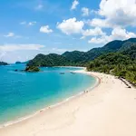 Panoramic view of Langkawi beach with turquoise waters and lush green hills