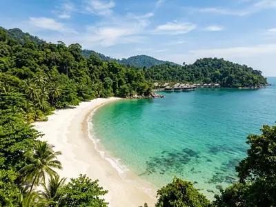 Emerald Bay at Pangkor Laut private island Malaysia with white sand and turquoise water