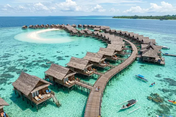 Sipadan-Kapalai Dive Resort overwater chalets on turquoise sandbar waters